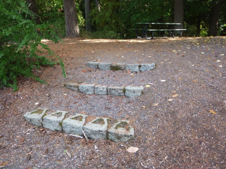 Picnic table by disc golf course – access by steps or steep natural surface
